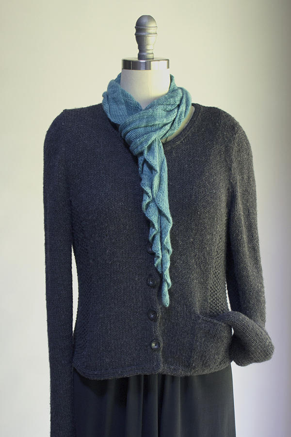 S-curve knitting pattern scarf with ribs, ruffles and ripples